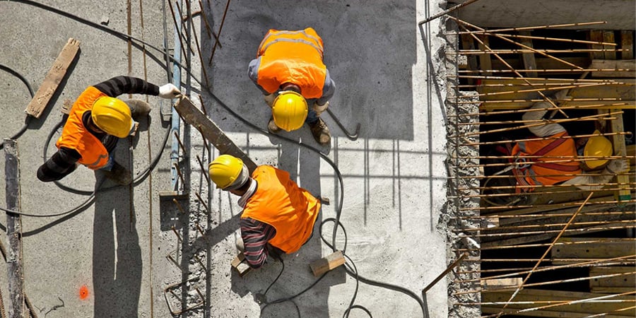 construction site with men working safely