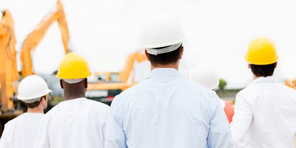 Group of architects looking at a construction site