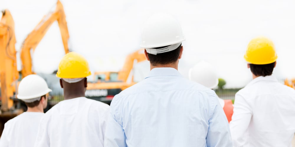 Group of architects looking at a construction site