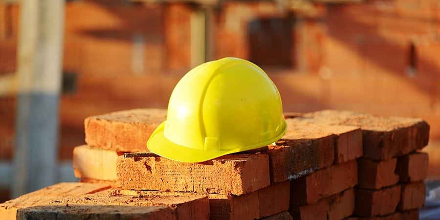Under construction, helmet and bricks for building site-1