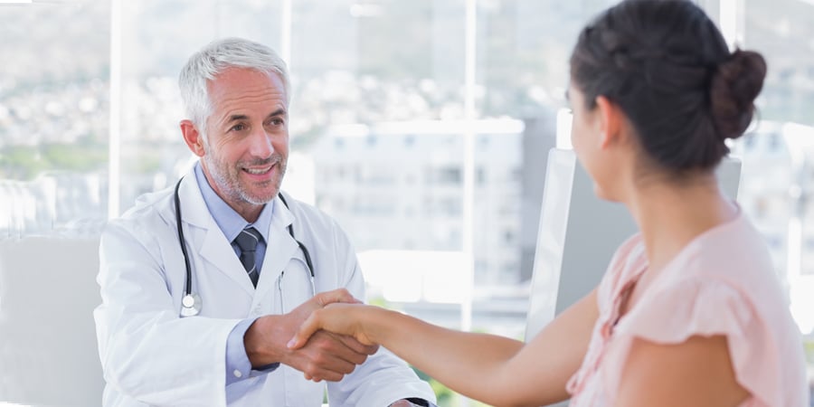 Doctor and patient shaking hands