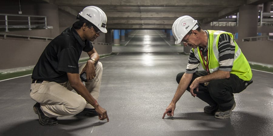 two men in hard hats training