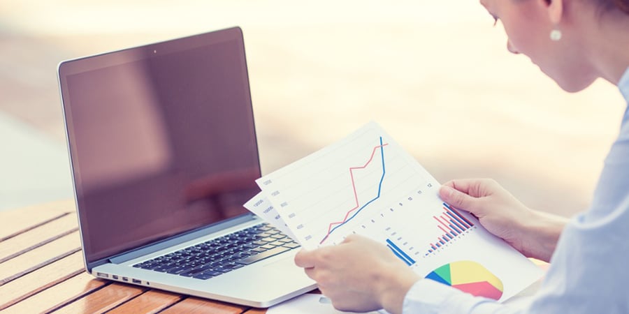 woman investment consultant analyzing company annual financial report balance sheet statement working with documents graphs. Stock market, office, tax, education concept. Hands with charts papers-1